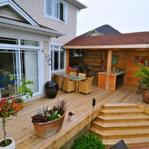 Outdoor Kitchen Design and Deck Construction By Alan's Landscaping and Heather's Gardens.